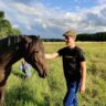 Daniel with a horse in a field